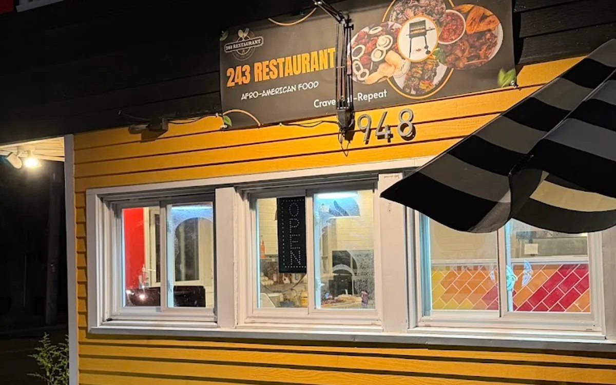 243 Restaurant’s illuminated storefront on Forest Avenue in Portland, Maine