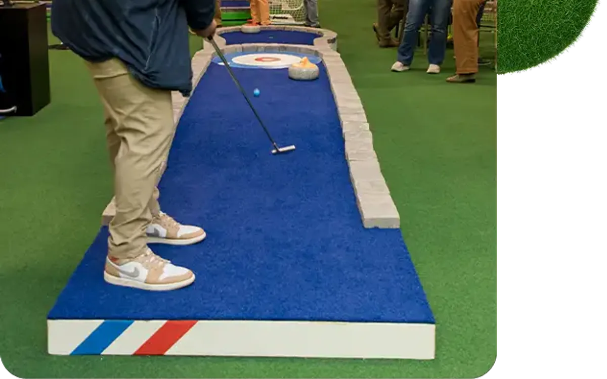 man putting in mini golf
