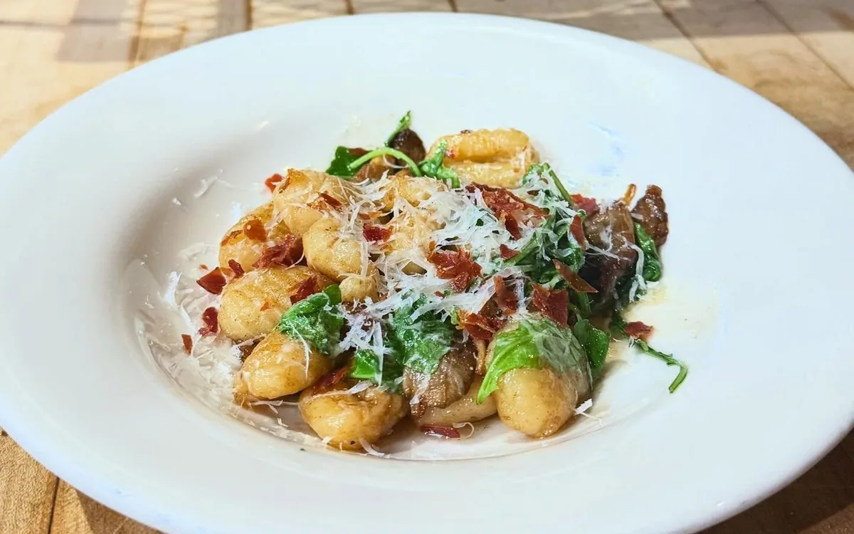 House-made potato gnocchi in brown butter with roasted oyster mushrooms &amp; arugula and topped with crispy prosciutto and grated Parmesan. Available on special tonight!